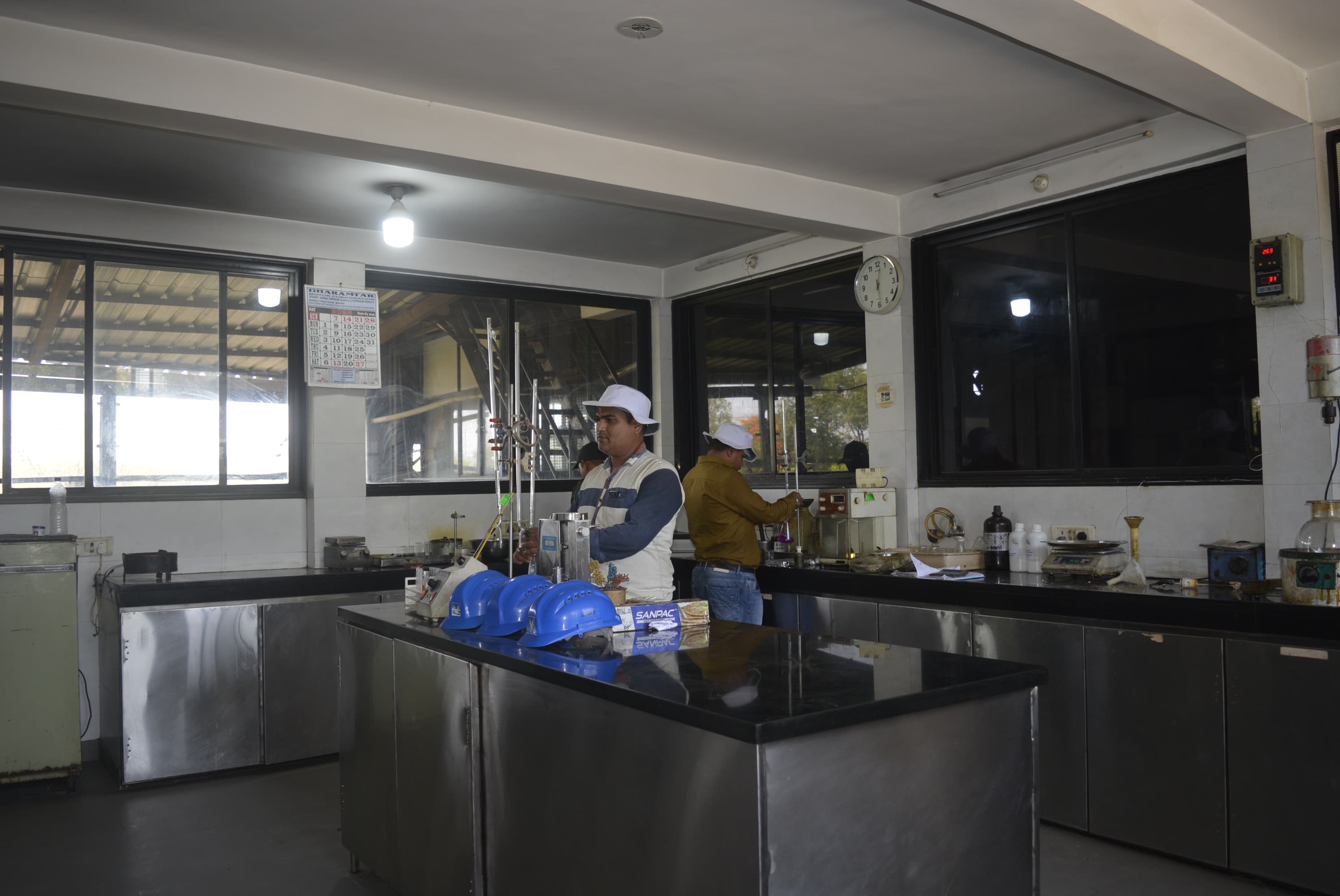 A technician running a batch test at the bench in the quality control laboratory